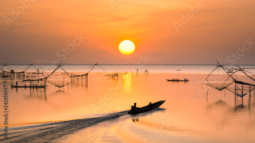 sunrisein the morning with Yor Building, Local fishing with big net, at Thale noi, Phatthalung, Thailand