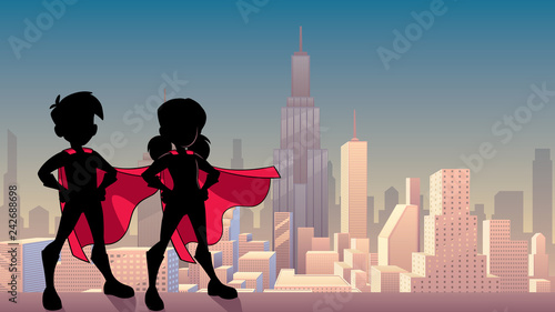 Silhouette illustration of superhero children wearing capes against city background for copy space.