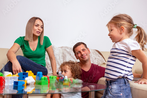 Family time - parent and children playing with blocks toys.