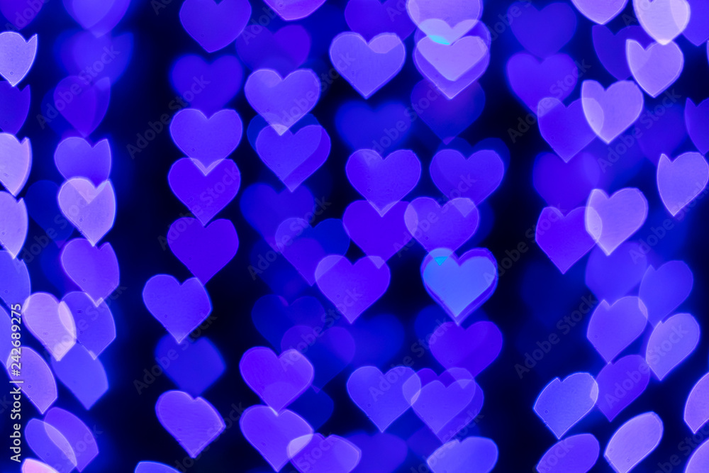 Heart-shaped bokeh lights on blurred.
Heart-shaped bokeh lights on blurred.