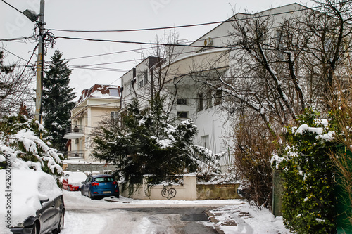 Street of town covered with snow. Belgrade is a largest town and capital of Serbia. Dedinje is a rich part of town. photo