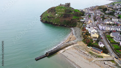 Aerial view over Criccieth Castle on a rocky peninsula overlooking Tremadog Bay in North Wales photo