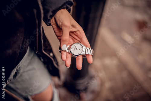 Stylish silver watch in woman hand