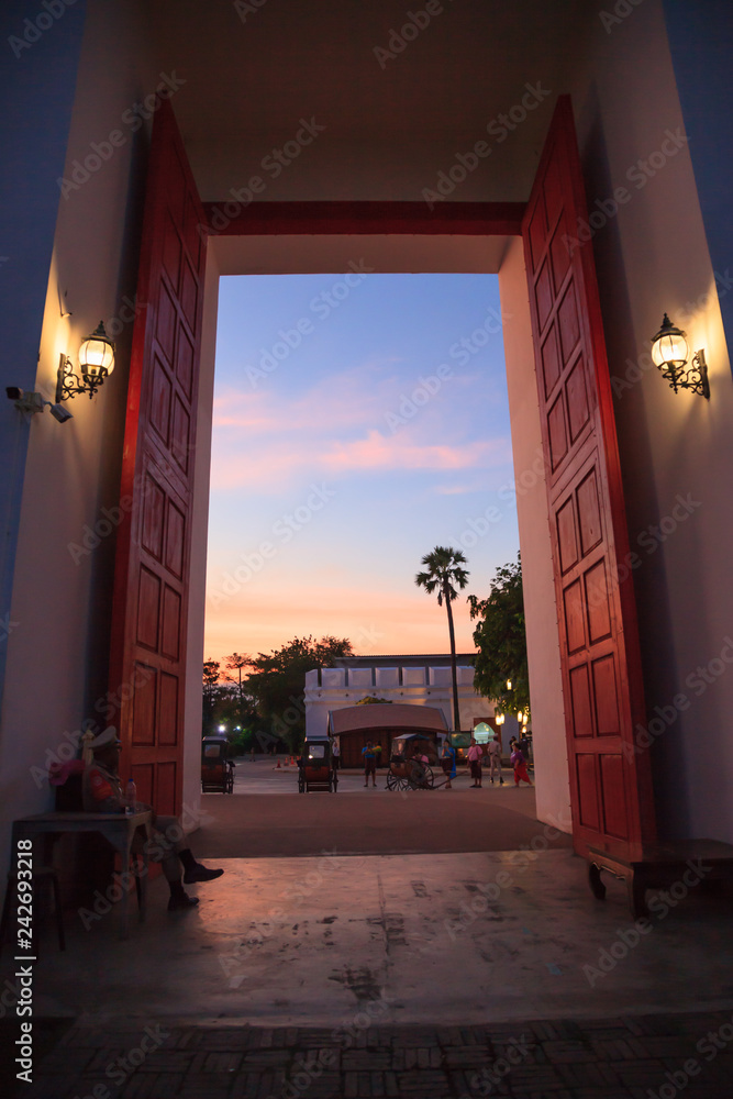 Traditional ancient Asian old town city gate entrance with beautiful twilight sky. Thailand Tourist Attraction Destination, Culture Travel, Tourism, Thai Architecture building, Art and history concept - obrazy, fototapety, plakaty 