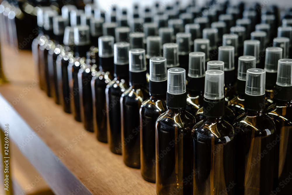 Obraz premium Set of glass dark brown bottles for cosmetics and medicine products. Minimalism
