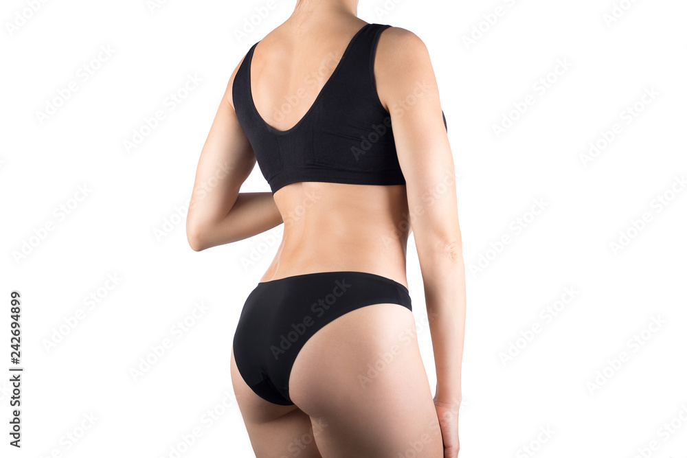 Female cropped fit body in black top and panties, isolated on white. Female cropped fit body in black top and panties, isolated on white.
