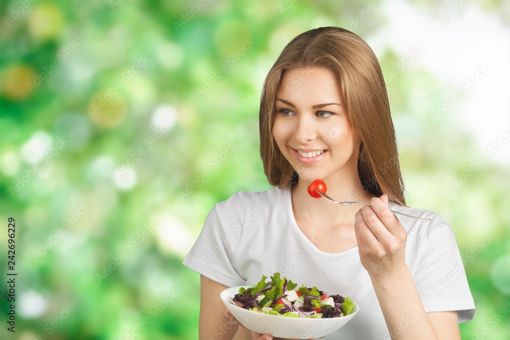 Attractive caucasian woman with salad on background Attractive caucasian woman with salad on background