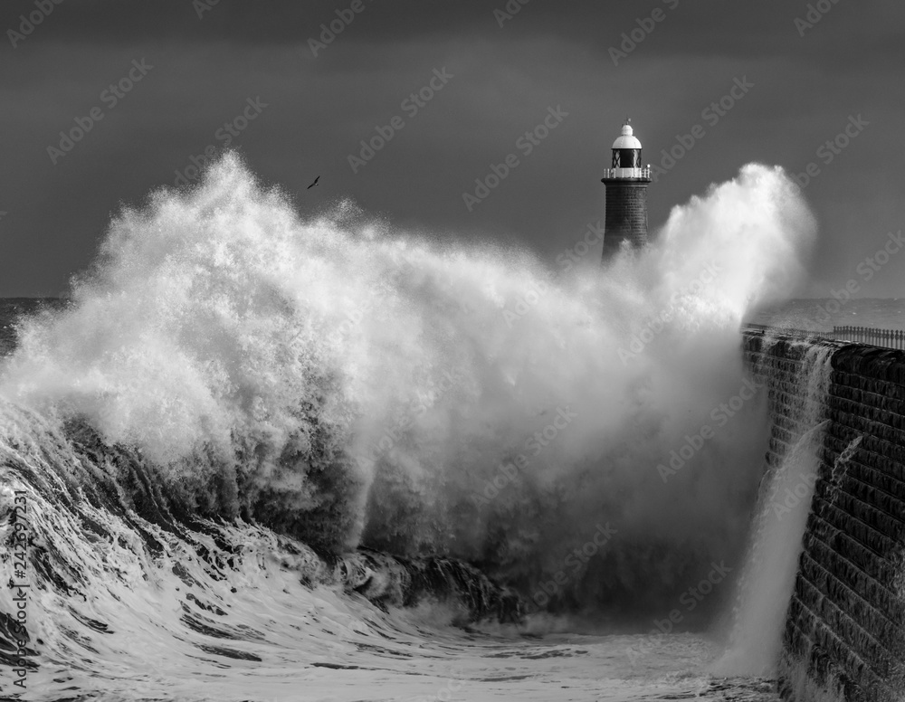 Waves crashing over Tyne Mouth pier