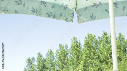 Bottom view of a parasol and the sky during a chill picnic in the summer holiday. photo