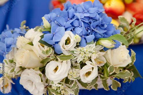 Blue hydrangea and white roses.