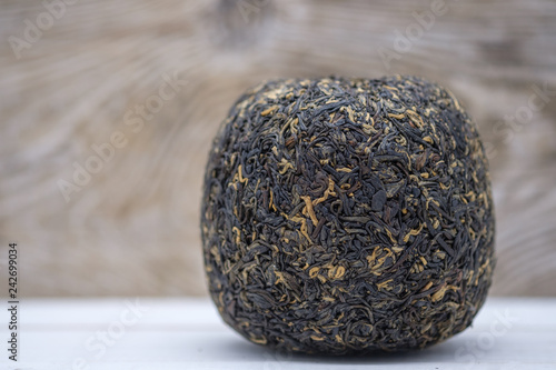 Chinese red tea Dian Hong, pressed in the shape of a ball photo