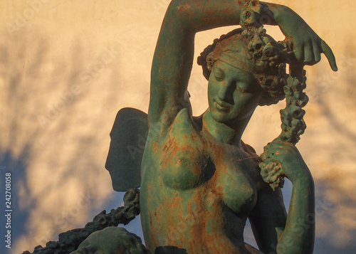 Beatiful iron statue of a nude young woman in Lisbon, Portugal.