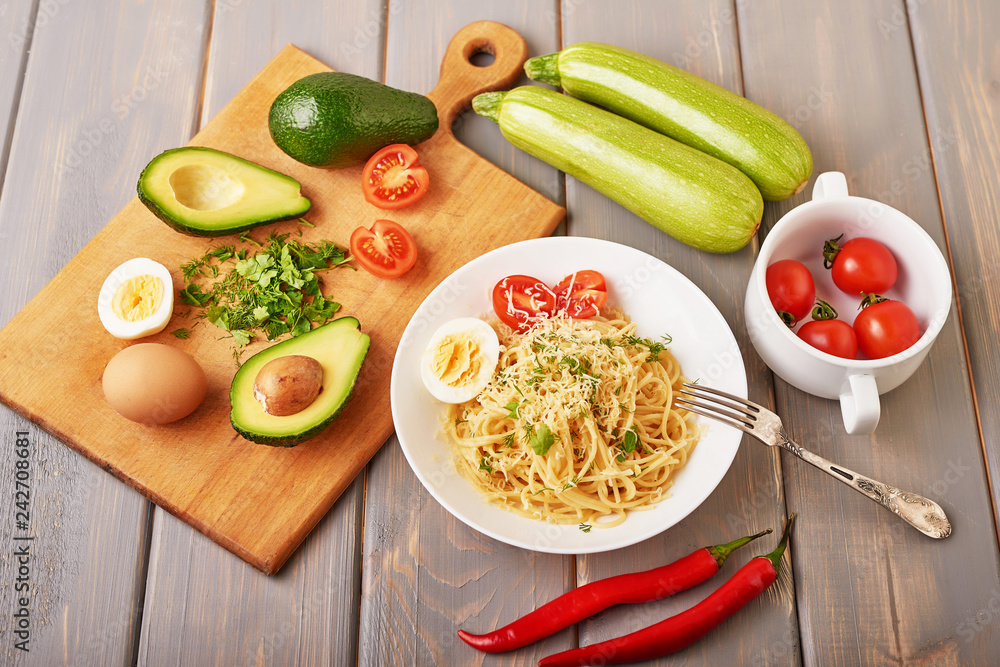 Vegetarian Vegetable pasta Fusilli with zucchini, tomatoes and avocados. Raw vegan pasta. Spaghetti. Italian food. Italy. Roma. Fine dining. Healthy food. Fresca Pasta. Vegetarian. Healthy food Vegetarian Vegetable pasta Fusilli with zucchini, tomatoes and avocados. Raw vegan pasta. Spaghetti. Italian food. Italy. Roma. Fine dining. Healthy food. Fresca Pasta. Vegetarian. Healthy food