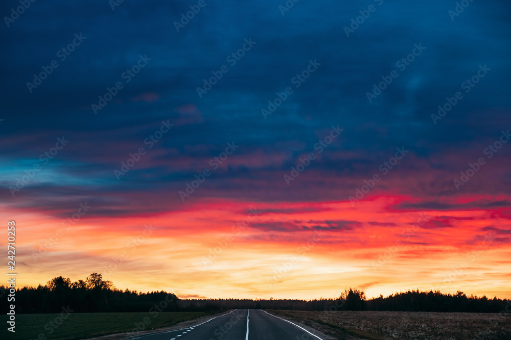 Asphalt Open Road Through Fields And Meadows At Sunset Or Sunris