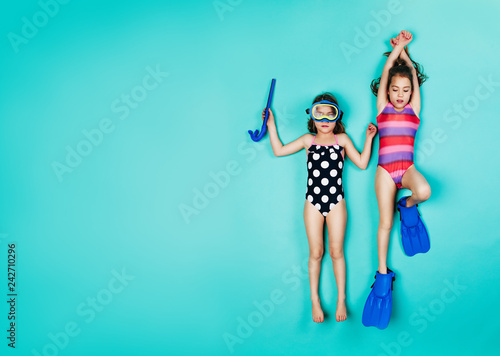 Принти на полотні Twin girls pretending to be snorkelling
