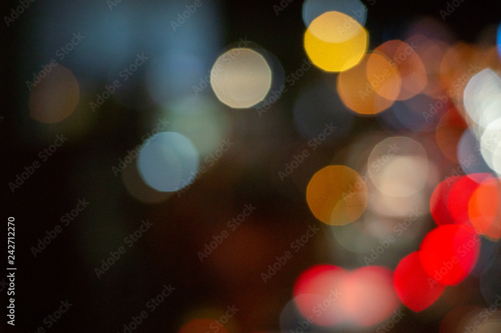 Bokeh night light on the avenue Light night at city blue bokeh sky festival abstract background blur lens flare reflection beautiful circle street with dark