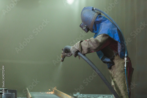 Foto Sandblast. Blasting metal.