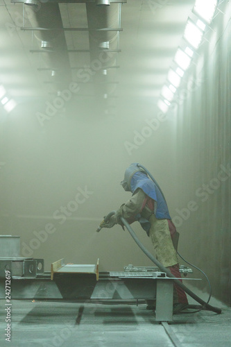 Sandblast. Blasting metal.