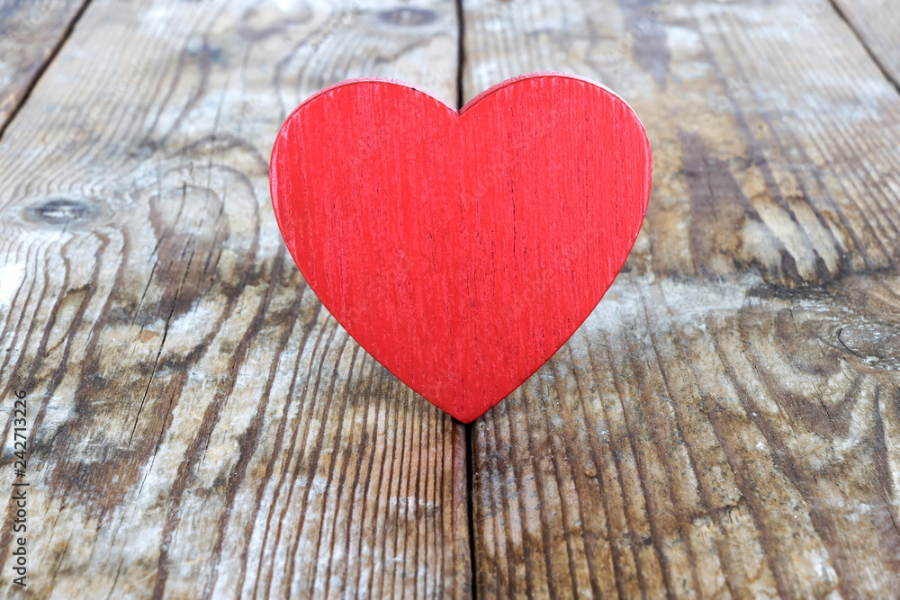 Valentine's Day. red heart on the background of old boards Valentine's Day. red heart on the background of old boards