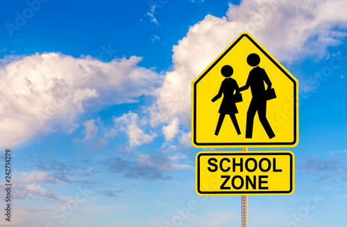 SCHOOL ZONE street sign with sky and clouds background