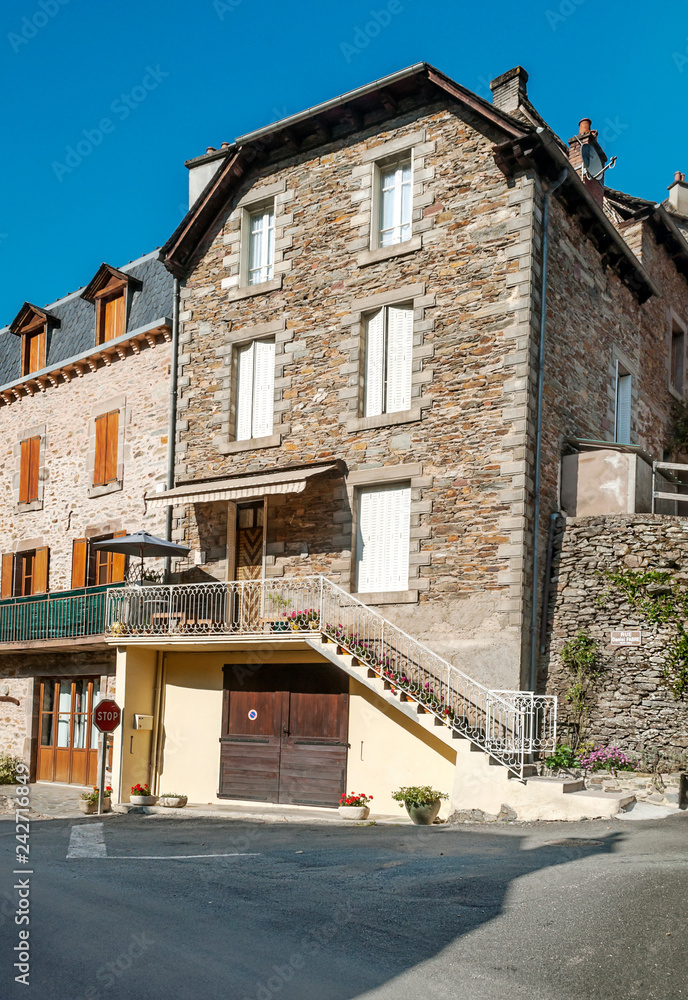 Streets of Conques in the mountains of southern France on a sunny day