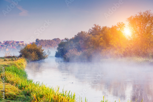 Fantastic foggy river in the sunlight. Location place Seret river, Ternopil.