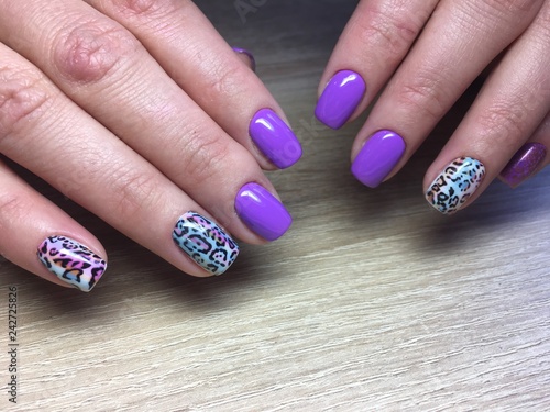 fashion manicure lilac and blue color and leopard