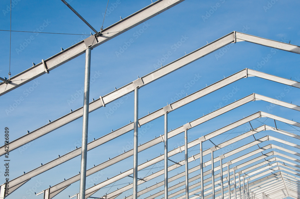 The structure of the building. Steel construction on the background of the winter landscape. The structure of the building. Steel construction on the background of the winter landscape.