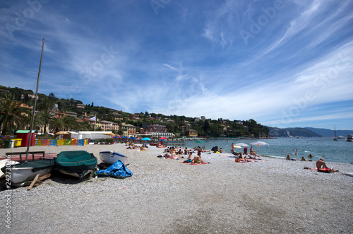 Rapallo / Italy - June 20 / 2016 : People resting at the beach of Rapallo