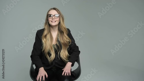 TV presenter tells interesting news. Woman talking in front of the camera to make vlog. Beautiful blonde guest TV show emotionally gives interviews on camera