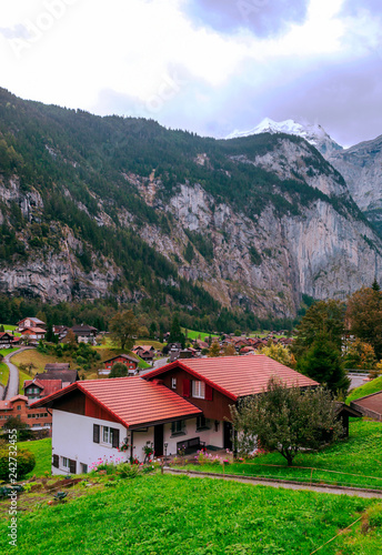 Wooden houses in the Swiss Alps on a cloudy day