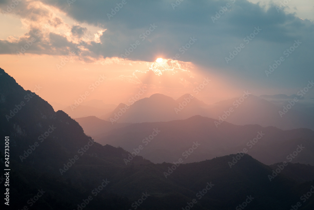 Sun through clouds from a mountain top in Laos