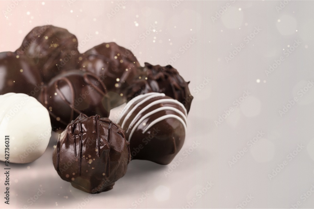 Fototapeta premium Close-up broken chocolate bar isolated on white background