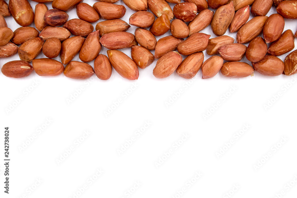 Red peanuts, fried peanuts. Peanuts on white background. Uncleaned peanuts. Red peanuts, fried peanuts. Peanuts on white background. Uncleaned peanuts.