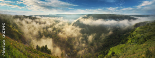 foggy canyon of a picturesque river. spring dawn