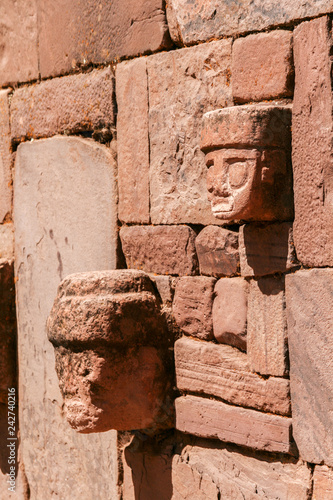 Side view of detailed stone head totem on Kalasayaya temple wall, Pumapunku, Tiwanaku, Bolivia photo