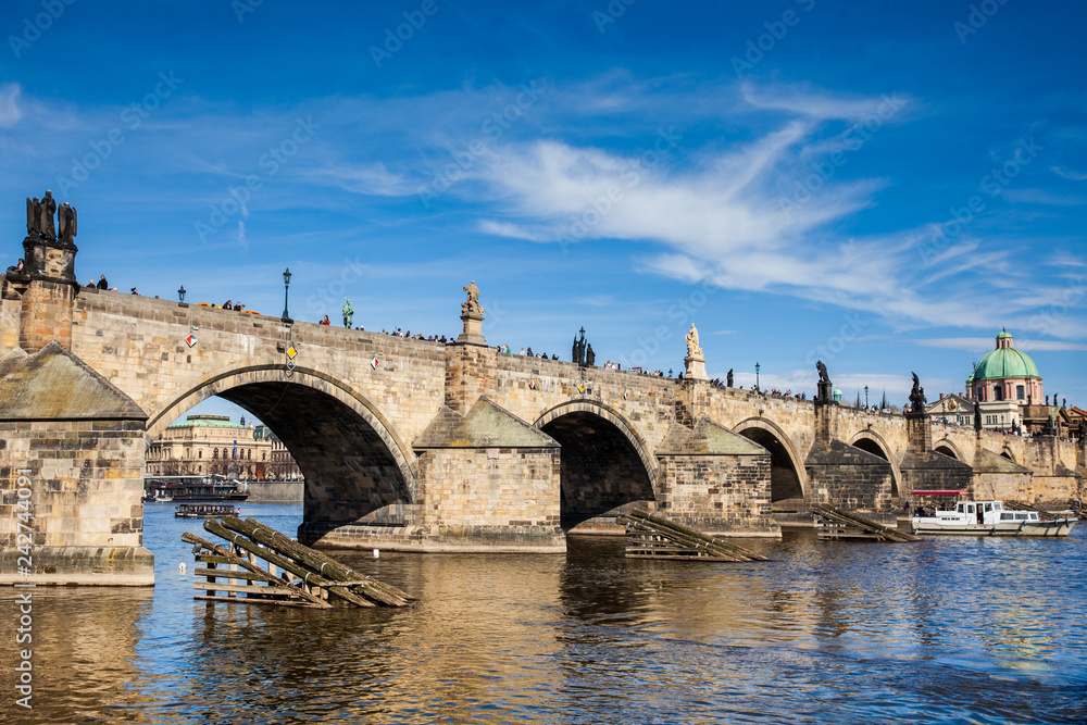 PRAGUE, CZECH REPUBLIC - APRIL, 2018: The medieval Charles Bridge over the Vltava river in Prague city