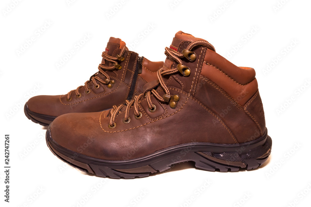 Pair of winter boots on the side on white isolated background Pair of winter boots on the side on white isolated background
