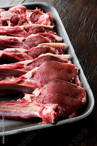 Package of Raw Lamb Chops Meat in Plastic Box / Container.