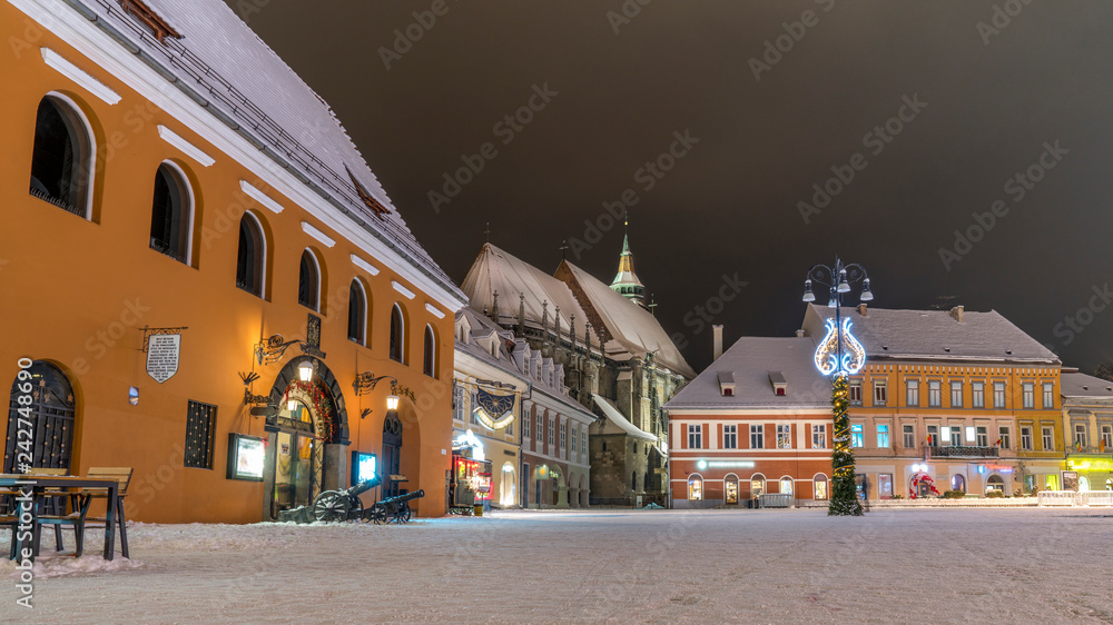 Brasov, Romania. Black Church in the old town square (Piata Sfatului) covered with snow. Brasov, probably the best town in the world.