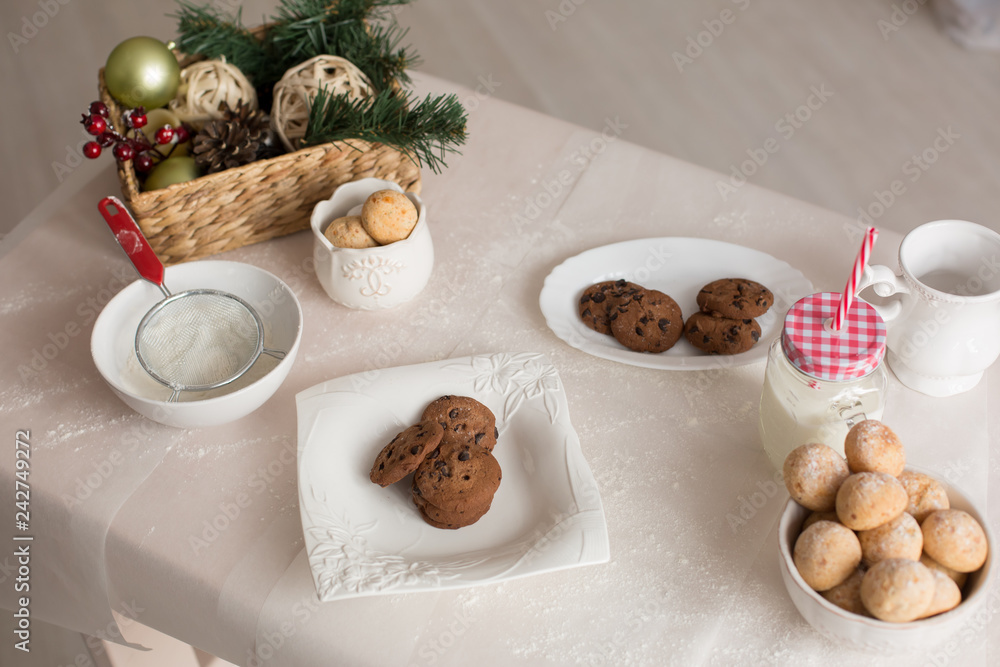 new year mood. glass of milk. cookie. Christmas gingerbread. gingerbread with milk. flour sieve