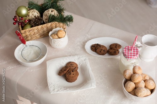 new year mood. glass of milk. cookie. Christmas gingerbread. gingerbread with milk. flour sieve