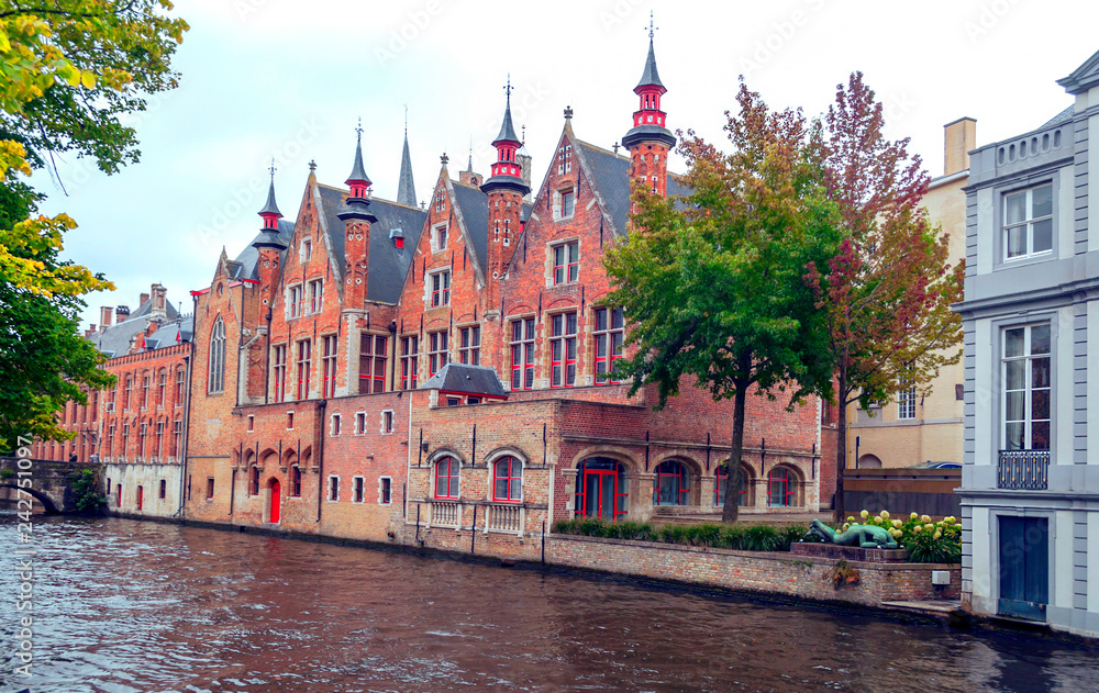 Streets of Bruges in Belgium with its medieval style facades on a cloudy day. Streets of Bruges in Belgium with its medieval style facades on a cloudy day.
