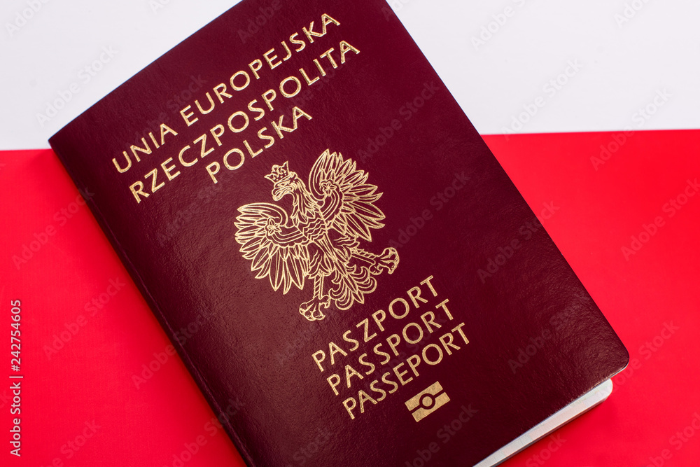Polish passport document on the background of Polish and European flag Polish passport document on the background of Polish and European flag