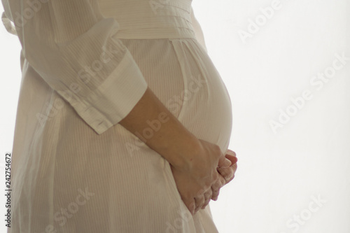 pregnant woman in white dress