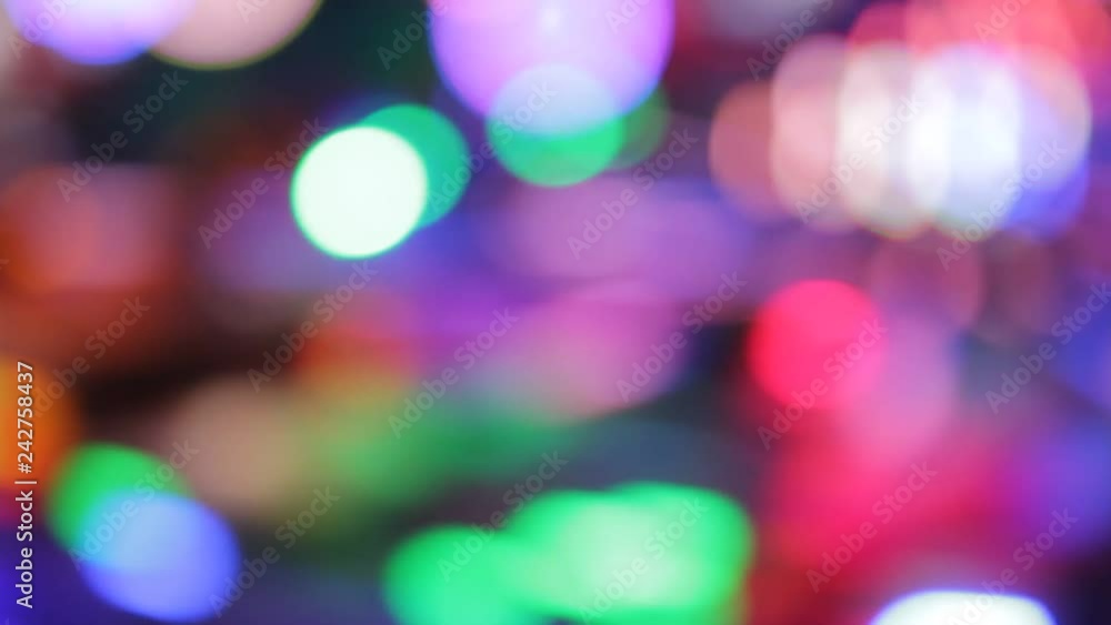 funfair fairground ride rainbow bokeh lights rides moving flashing people at night funfair fairground ride rainbow bokeh lights rides moving flashing people at night