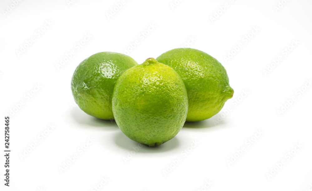 three ripe green limes isolated on white three ripe green limes isolated on white