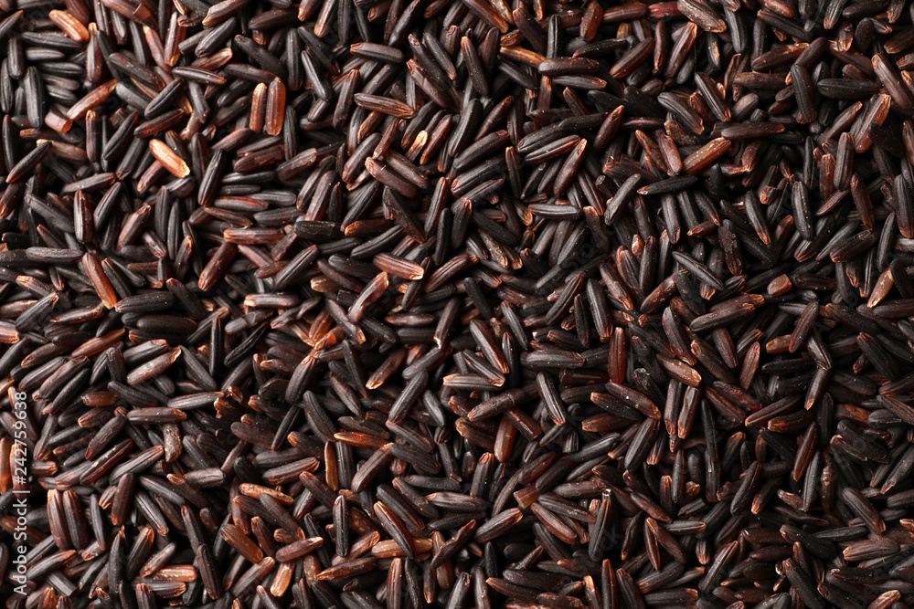 Raw brown rice as background, top view Raw brown rice as background, top view