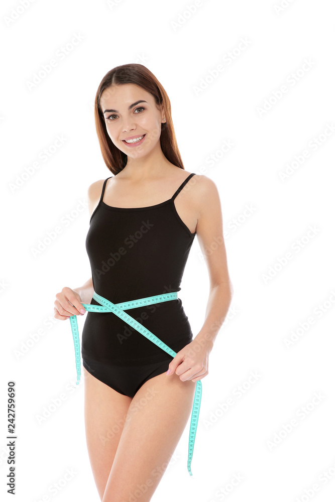Slim woman measuring her waist on white background. Weight loss Slim woman measuring her waist on white background. Weight loss