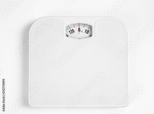 Modern scales isolated on white, top view photo